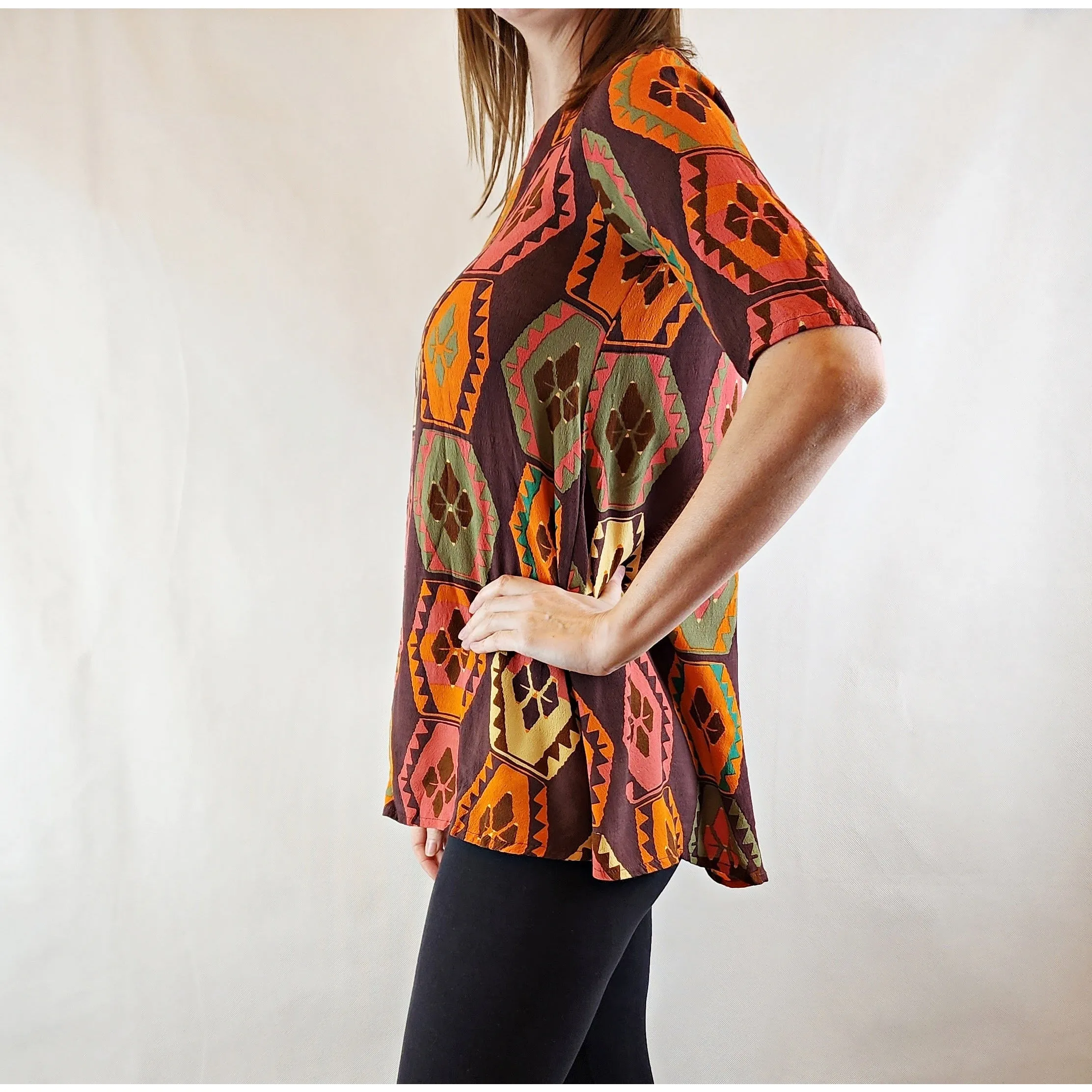 Mister Zimi brown tee shirt with orange, green and beige print size 6