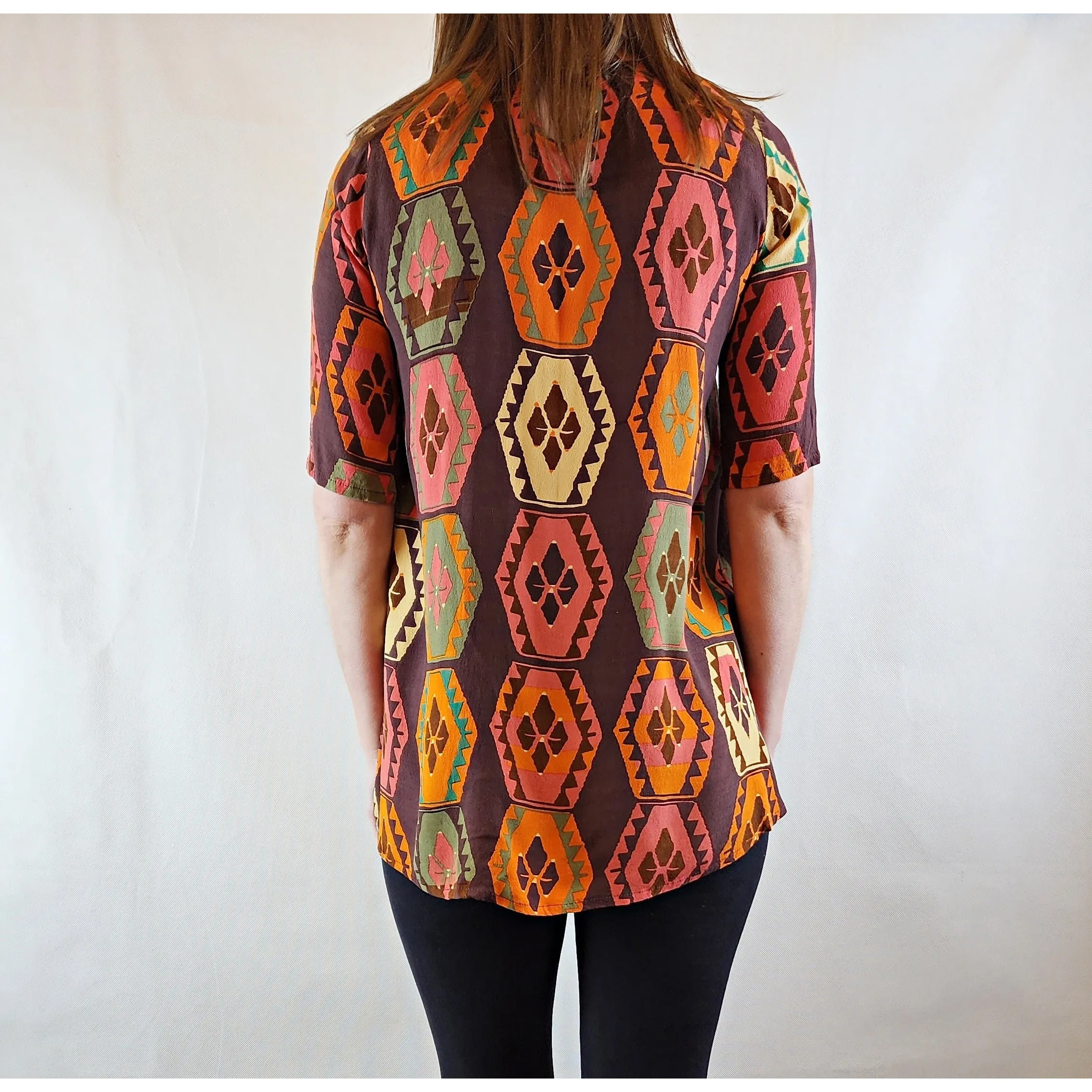 Mister Zimi brown tee shirt with orange, green and beige print size 6