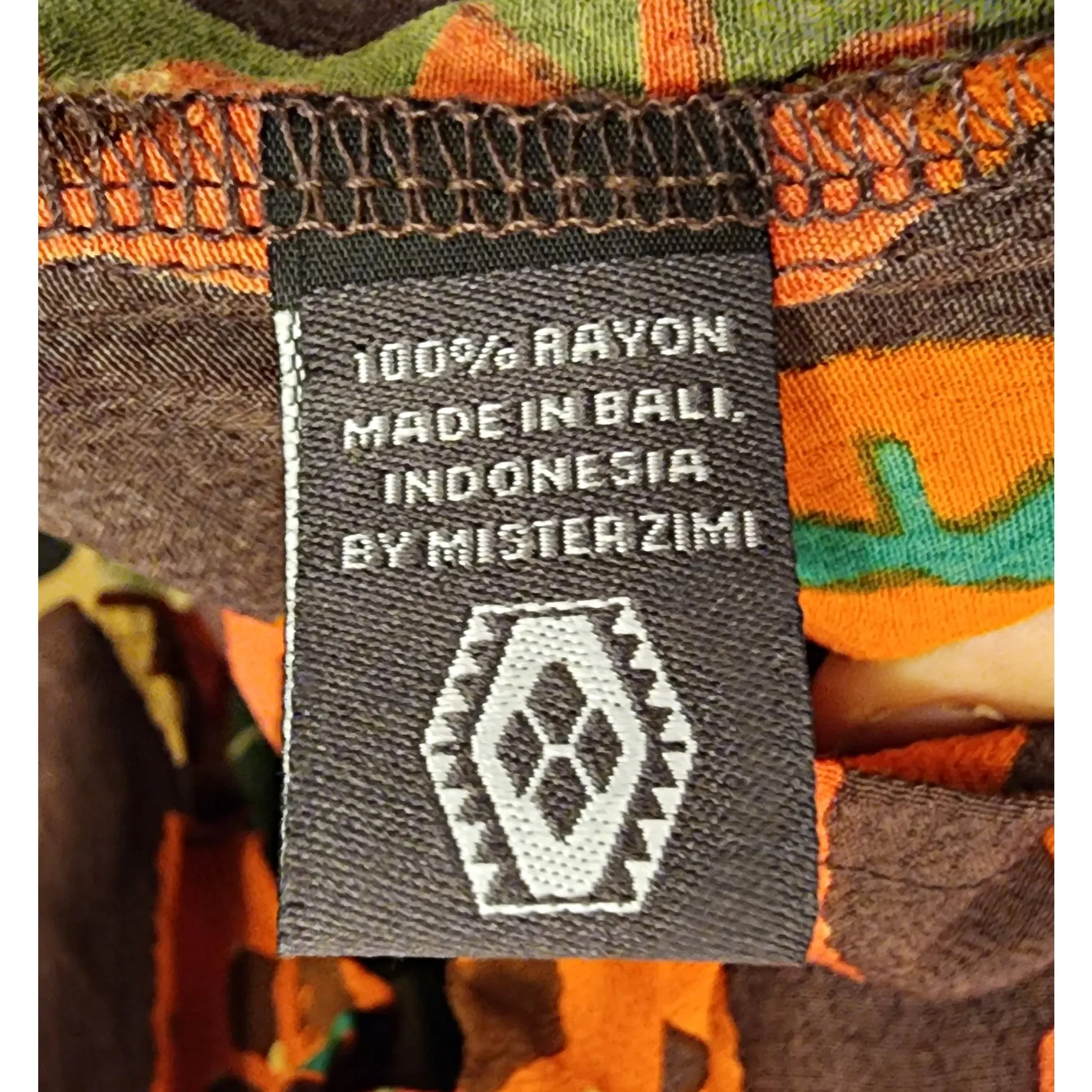 Mister Zimi brown tee shirt with orange, green and beige print size 6