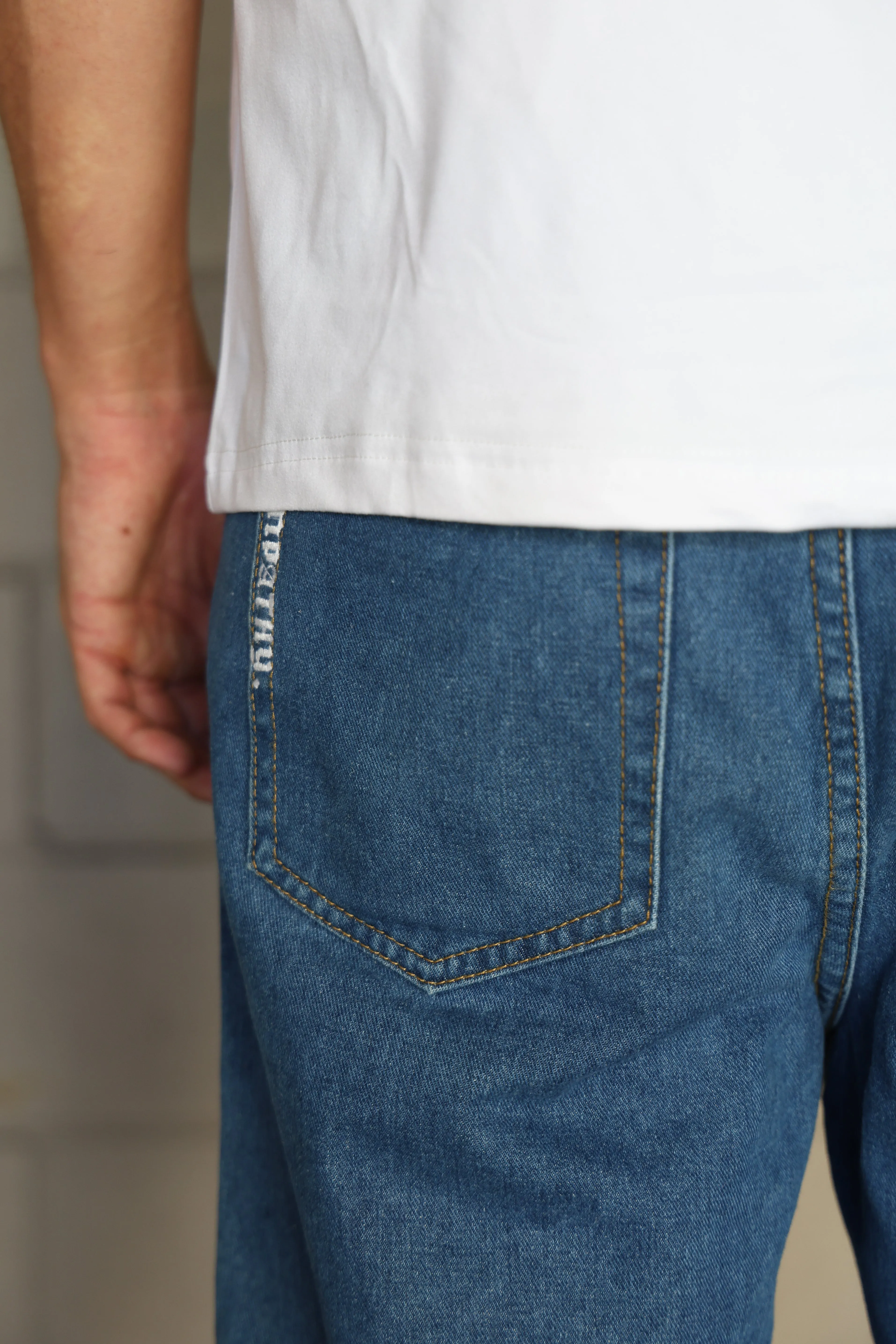SKEG EMBROIDERED EMPATHY DENIM WALK SHORTS