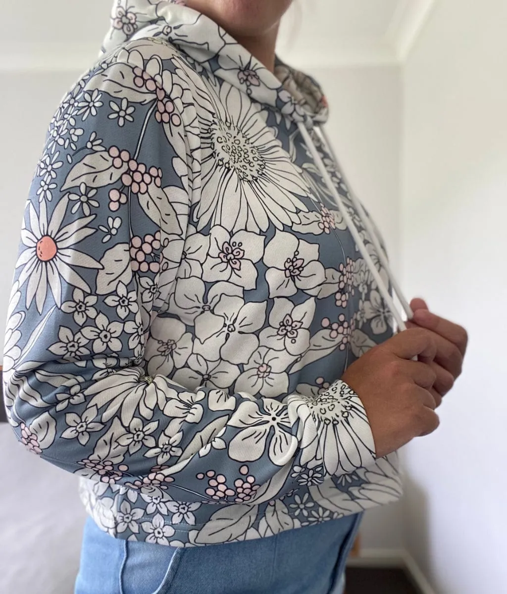 Snowy Field Of Flowers Women's Cropped Hoodie