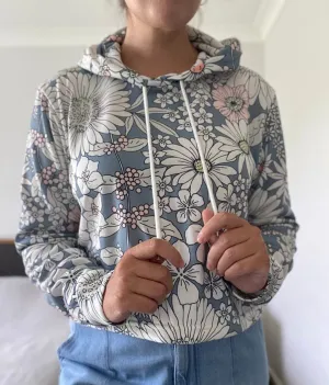 Snowy Field Of Flowers Women's Cropped Hoodie