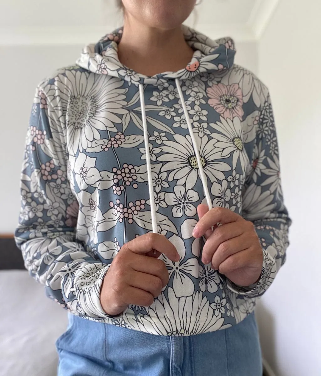 Snowy Field Of Flowers Women's Cropped Hoodie